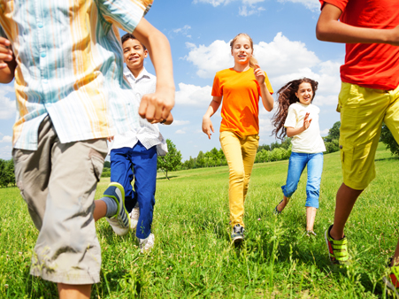 Youth running through the grass